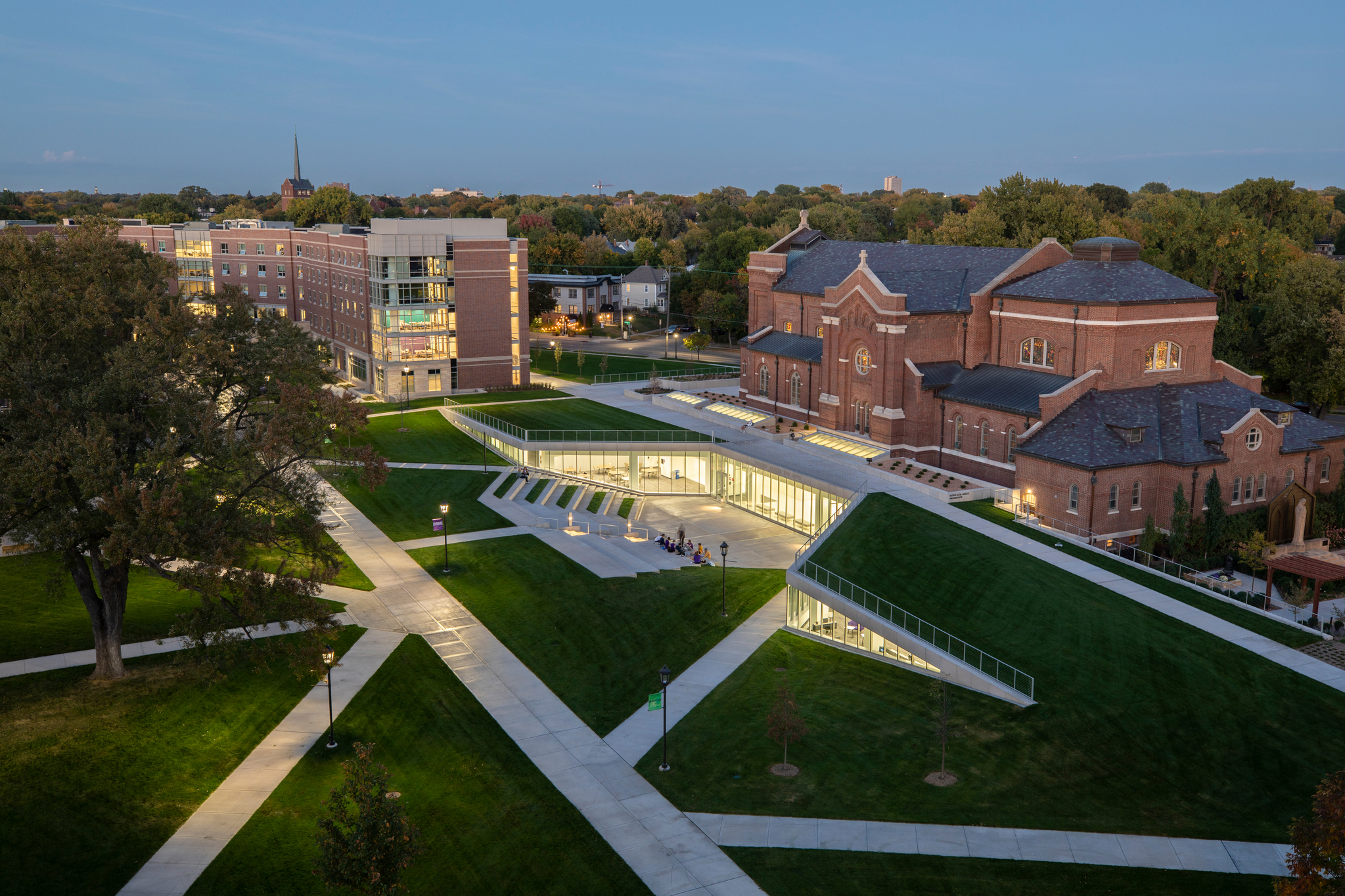 A wide view of the upper quad featuring the Iversen Center for Faith, Aquinas Chapel and Tommie North Residence Hall as photographed at dusk on the rooftop of Brady Hall in St. Paul on September 29, 2020.