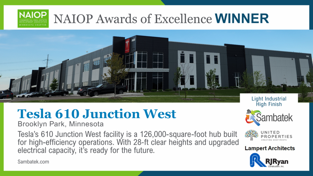 Photo of Tesla’s 610 Junction West building in Brooklyn Park, Minnesota, featuring logos of project partners and Sambatek. The 126,000-square-foot light industrial facility has high-finish design, 28‑ft clear heights, and upgraded electrical capacity. Includes NAIOP Awards of Excellence WINNER designation.